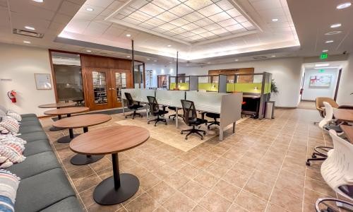 Open workspace and meeting tables at the Crown Point office